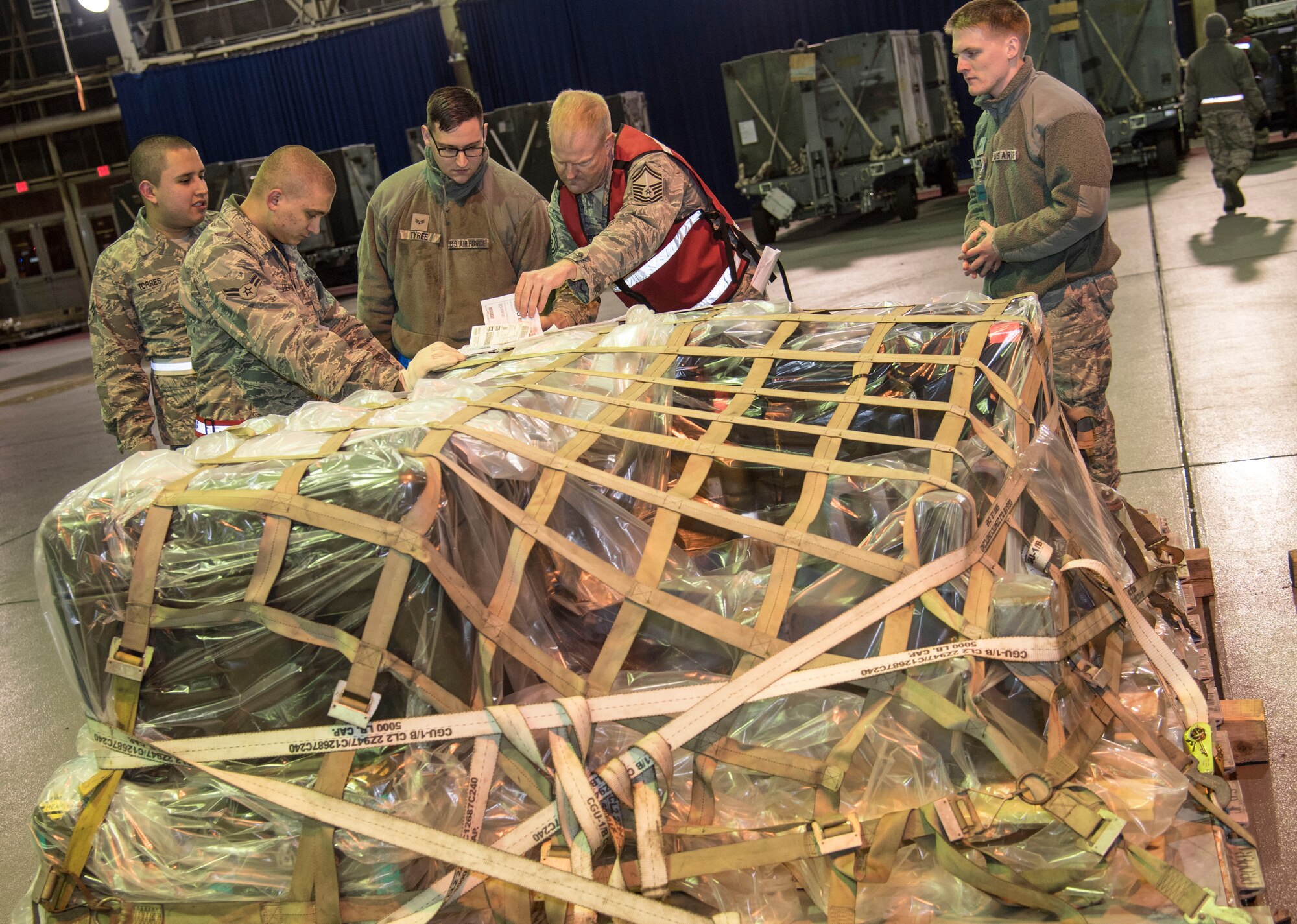 U.S. Air Force Airmen with the 35th Logistics Readiness Squadron conduct an inventory of cargo for shipment at Misawa Air Base, Japan, March 15, 2016. Inventory and inspection of cargo is essential before shipment to ensure safe travel. (U.S. Air Force photo by Airman 1st Class Jordyn Fetter)