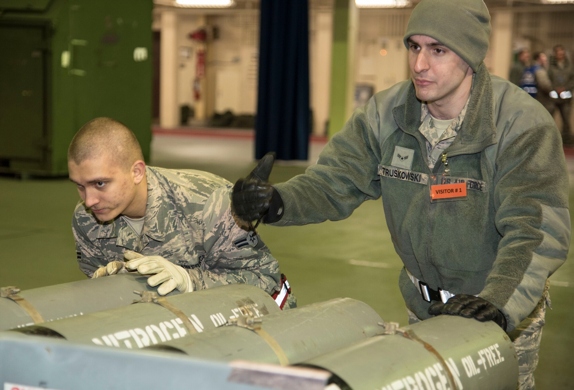 U.S. Air Force Airman 1st Class Jordan Herring, a 35th Medical Support Squadron logistician, left, and Airman 1st Class Truskowski, 35th Logistics Readiness Squadron vehicle and equipment mechanic apprentice, right, move cargo onto a scale at Misawa Air Base, Japan, March 15, 2016. Cargo is weighed to ensure proper balance on transport aircraft. (U.S. Air Force photo by Airman 1st Class Jordyn Fetter)