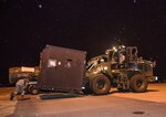 U.S. Air Force Airmen with the 35th Logistics Readiness Squadron lift cargo at Misawa Air Base, Japan, March 16, 2016. As Misawa’s units prepared for mock deployment, aircraft maintenance equipment and personal gear were loaded onto pallets ready for transport. (U.S. Air Force photo by Airman 1st Class Jordyn Fetter)