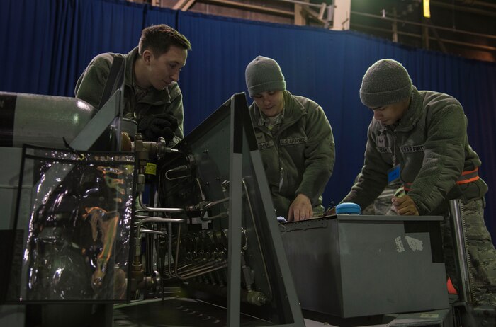 Cargo deployment function Airmen calculate the weight of cargo at Misawa Air Base, Japan, March 15, 2016. Shipments are appropriately proportioned for transport aircraft through the use of measuring tapes, scales and calculations. (U.S. Air Force photo by Airman 1st Class Jordyn Fetter)