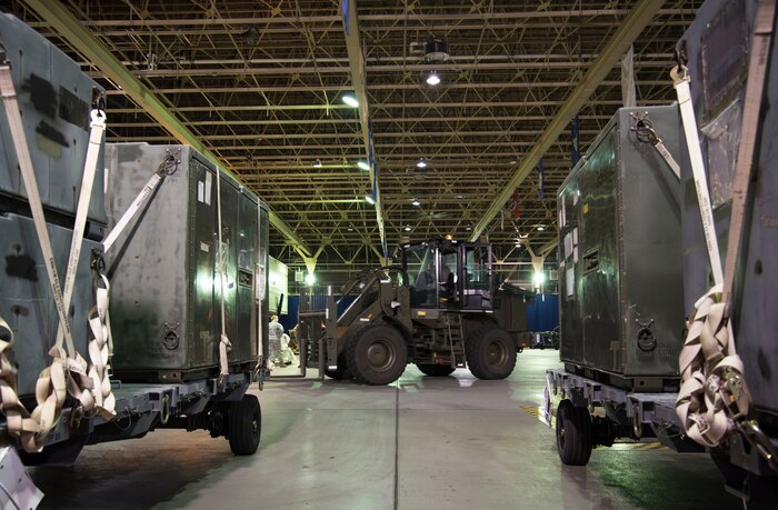 U.S. Air Force Airmen with the 35th Logistics Readiness Squadron move cargo at Misawa Air Base, Japan, March 15, 2016. In support of Beverly Sunrise 16-03, an operational readiness exercise, the cargo deployment function packed up and prepared all necessary equipment for mock deployment. (U.S. Air Force photo by Airman 1st Class Jordyn Fetter)