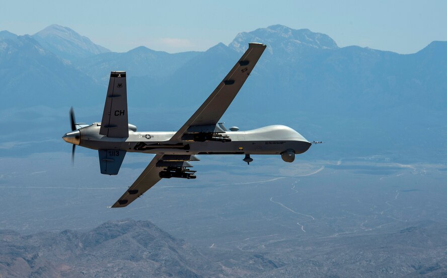An MQ-9 Reaper remotely piloted aircraft performs aerial maneuvers over Creech Air Force Base, Nev., June 25, 2015. The MQ-9 Reaper is an armed, multi-mission, medium-altitude, long-endurance remotely piloted aircraft that is employed primarily as an intelligence-collection asset and secondarily against dynamic execution targets. (U.S. Air Force photo by Senior Airman Cory D. Payne/Not Reviewed)