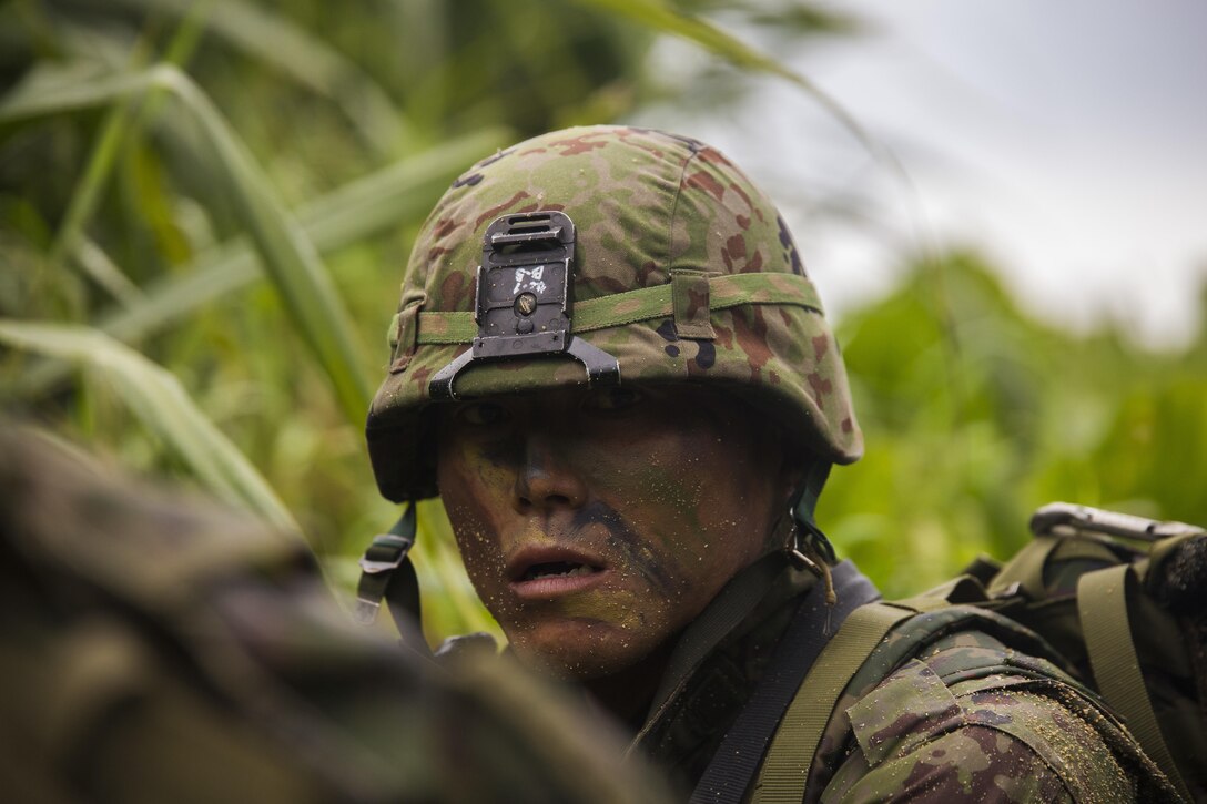 A Japan Ground Self-Defense Force member provides security Mar. 11, at Kin Blue, Okinawa, Japan. The JGSDF observed U.S. Marines with 3rd Reconnaissance Battalion, 3rd Marine Division, III Marine Expeditionary Force, conducting raid missions, amphibious training and scout swimmer classes. The JGSDF members are with the 43rd Infantry Regiment, 8th Division, Western Army. (U.S. Marine Corps photo by Cpl. Isaac Ibarra/Released)