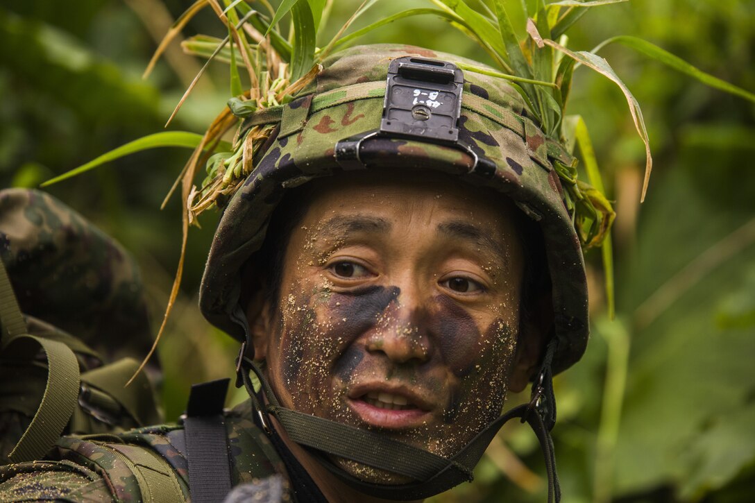 A Japan Ground Self-Defense Force service member provides security for his team Mar. 11, at Kin Blue, Okinawa, Japan. The JGSDF observed U.S. Marines with 3rd Reconnaissance Battalion, 3rd Marine Division, III Marine Expeditionary Force, conducting raid missions, amphibious training and scout swimmer classes. The JGSDF members are with the 43rd Infantry Regiment, 8th Division, Western Army. (U.S. Marine Corps photo by Cpl. Isaac Ibarra/Released)