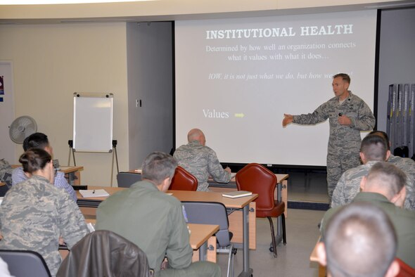 Lt. Col. Trevor Rosenberg, Profession of Arms Center of Excellence instructor, discusses strategic priorities and ways to effectively lead with 51st Fighter Wing leadership March 17, 2016, at Osan Air Base, Republic of Korea.  The Profession of Arms Center of Excellence is committed to developing Air Force personnel with the professional mindset, character and core values required to succeed today and well into the future. (U.S. Air Force photo Staff Sgt. Benjamin Sutton/Released)