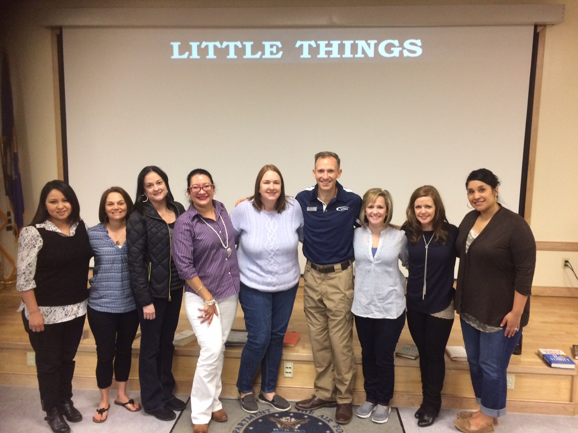 Lt. Col. Trevor Rosenberg, Profession of Arms Center of Excellence instructor, poses for a photo with spouses of 51st Fighter Wing members March 18, 2016, at Osan Air Base Korea. The PACE leadership training focuses on studies, analysis and assessment for command strategic priorities associated with Air Force professionalism. (Courtesy photo)