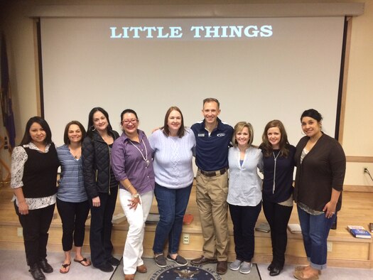 Lt. Col. Trevor Rosenberg, Profession of Arms Center of Excellence instructor, poses for a photo with spouses of 51st Fighter Wing members March 18, 2016, at Osan Air Base Korea. The PACE leadership training focuses on studies, analysis and assessment for command strategic priorities associated with Air Force professionalism. (Courtesy photo)