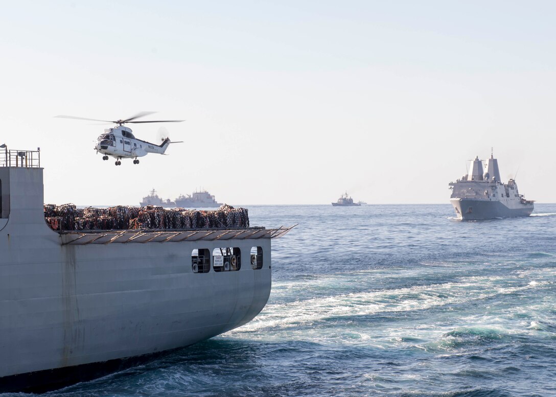 An SA330-J Puma helicopter prepares to transfer supplies from the flight deck of Military Sealift Command dry cargo and ammunition ship USNS Wally Schirra (T-AKE 8) as the amphibious transport dock ship USS New Orleans (LPD 18) transits during a vertical replenishment. New Orleans is part part of the Boxer Amphibious Ready Group and is participating in Exercise Ssang Yong 16. Ssang Yong is a biennial combined amphibious exercise conducted by forward-deployed U.S. forces with the Republic of Korea Navy and Marine Corps, Australian Army and Royal New Zealand Army Forces in order to strengthen our interoperability and working relationships across a wide range of military operations - from disaster relief to complex expeditionary operations. (U.S. Navy photo by Mass Communication Specialist 3rd Class Jesse Monford/Released)