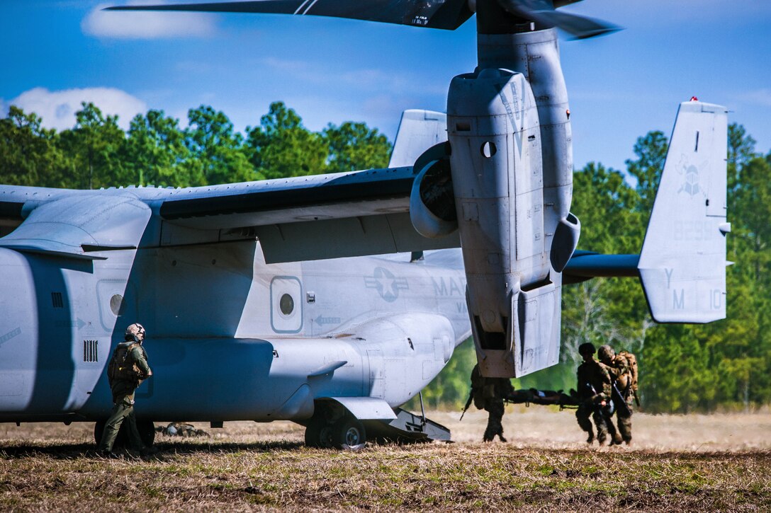 Marines load a casualty into an MV-22B Osprey aircraft during a casualty evacuation exercise at landing zone Penguin on Camp Lejeune, N.C., March 10, 2016. Marine Corps photo by Lance Cpl. Erick Galera