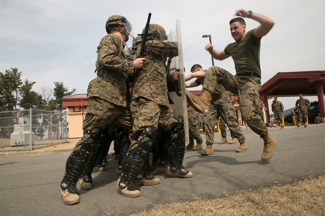 Cpl. Robert T. Sweeney, a military policeman with Company C, 3d Law Enforcement Battalion, role plays an aggressor during riot control training at Camp Mujuk, South Korea, March 17, 2016. Sweeney, and his fellow Marines in Company C are participating in Exercise Ssang Yong 16, a biennial combined amphibious exercise conducted by forward-deployed U.S. forces with the Republic of Korea Navy and Marine Corps, Australian Army and Royal New Zealand Army Forces in order to strengthen our interoperability and working relationships across a wide range of military operations.