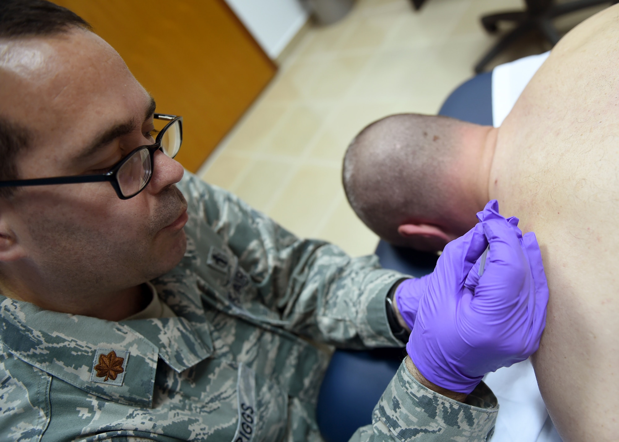 Maj. Robert Briggs, 386th Expeditionary Medical Group physical therapist, conducts trigger point dry needling therapy on a patient at an undisclosed location in Southwest Asia, Feb. 12, 2016. The physical therapy was established to meet the growing needs of Airmen and coalition forces deployed in support of Operation INHERENT RESOLVE. (U.S. Air Force photo by Staff Sgt. Jerilyn Quintanilla)