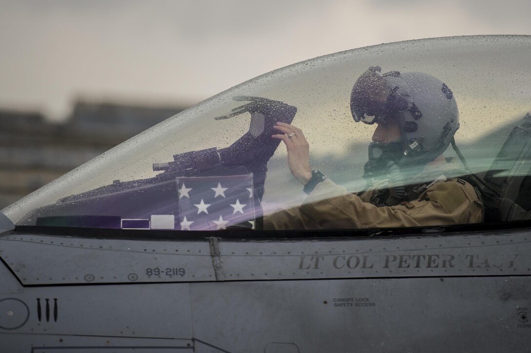 Air Force Capt. Tim Six performs preflight checks inside the cockpit of his F-16 Fighting Falcon aircraft on Bagram Airfield, Afghanistan, March 14, 2016, before a combat sortie. Air Force photo by Tech. Sgt. Robert Cloys