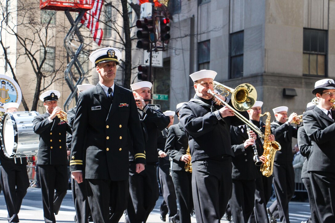 Navy Lt. Greg Fritz, front left, director of Navy Band Northeast, marches alongside the band during the 255th St. Patrick's Day Parade in New York City, March 17, 2016. Navy photo by Lt. Matthew Stroup
