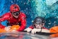 Master Sgt. Chris Seinkner, 308th Rescue Squadron, Patrick AFB, Fla., teams up with Staff Sgt. Eli Reynolds, of the 88th Test and Evaluation Squadron, Nellis AFB, Nev., to install the stabilization collar on the Orion Capsule during a recent exercise at NASA’s Neutral Buoyancy Lab in Houston, Texas. The Air Force and NASA work together to prepare for contingency landing site support, payload security, medical support, coordination of airlift/sealift for contingency operations, as well as other support services required in the event of a spacecraft emergency. The 45th Operations Group’s Detachment 3, located at Patrick AFB, was chartered in 1959 by the Secretary of Defense as the DoD Mercury Support Office [later renamed DoD Manned Space Flight Support Office], its express purpose is providing DoD support to our nation's human space flight programs, putting people into space and returning them safely to Earth. (Courtesy photo/NASA)
