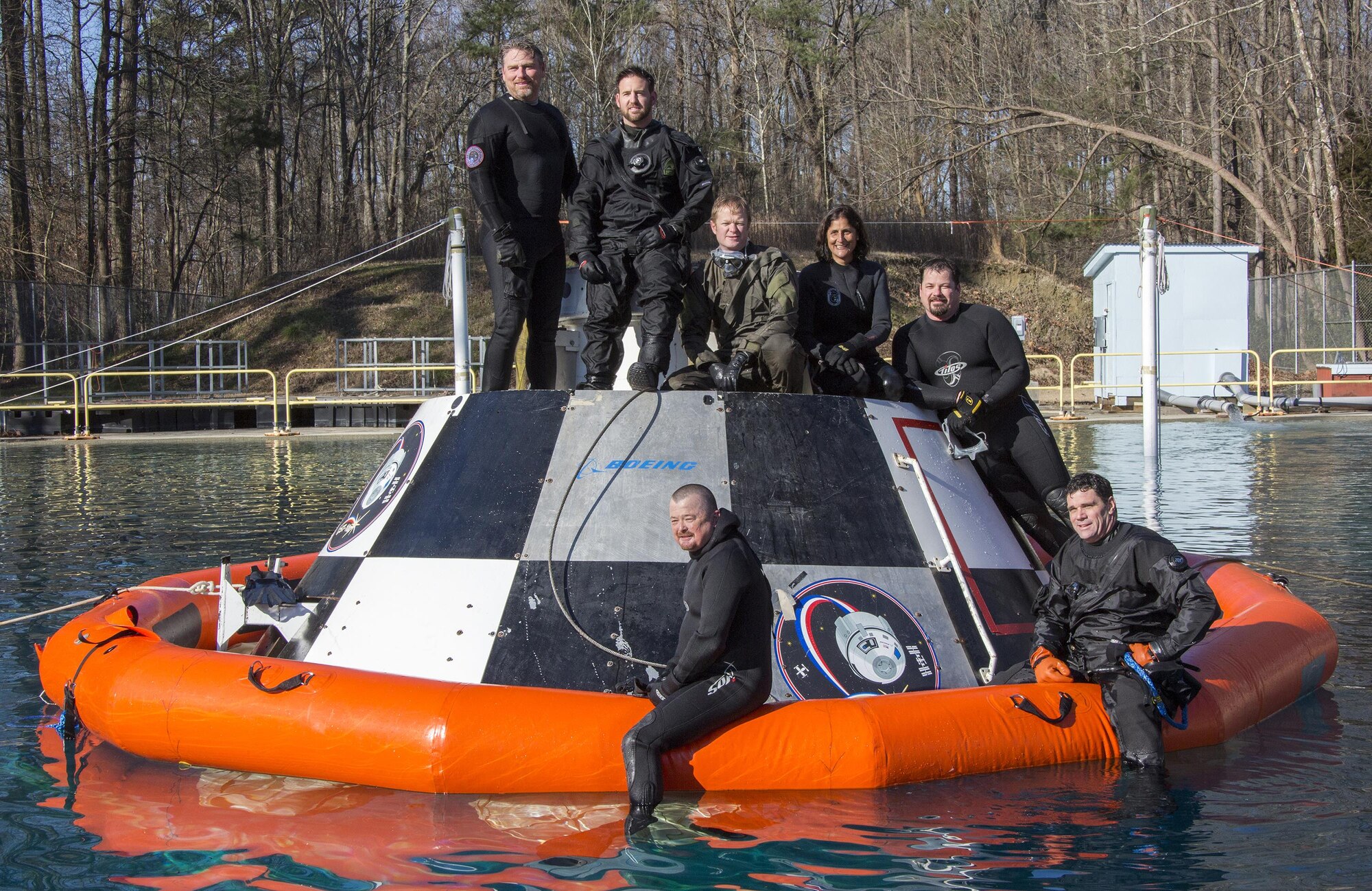 Para-rescue Jumpers working on securing a stabling flotation device on the Boeing CST100 Test Capsule in Langley Research Center’s Splash Impact Basin. Astronaut Suni Williams was on hand and in the water to witness the test. The water and air temperatures during the test were in the low 40s. 02/10/2016