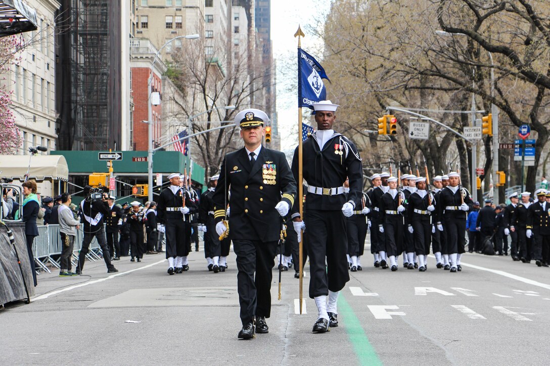 Navy Cmdr. John Giuseppe, left, commander of the Navy Ceremonial Guard, leads the command up Fifth Avenue during the 255th St. Patrick's Day Parade in New York City, March 17, 2016. Navy photo by Lt. Matthew Stroup