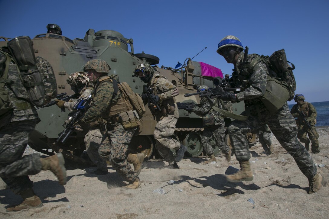 U.S. Marines and troops from New Zealand, South Korea and Australia conduct an amphibious assault rehearsal during Exercise Ssang Yong 16 on Doksukri Beach in South Korea, March 11, 2016. Ssang Yong is a biennial military exercise focused on strengthening the amphibious landing capabilities of the participating nations. Marine Corps photo by Cpl. Allison Lotz