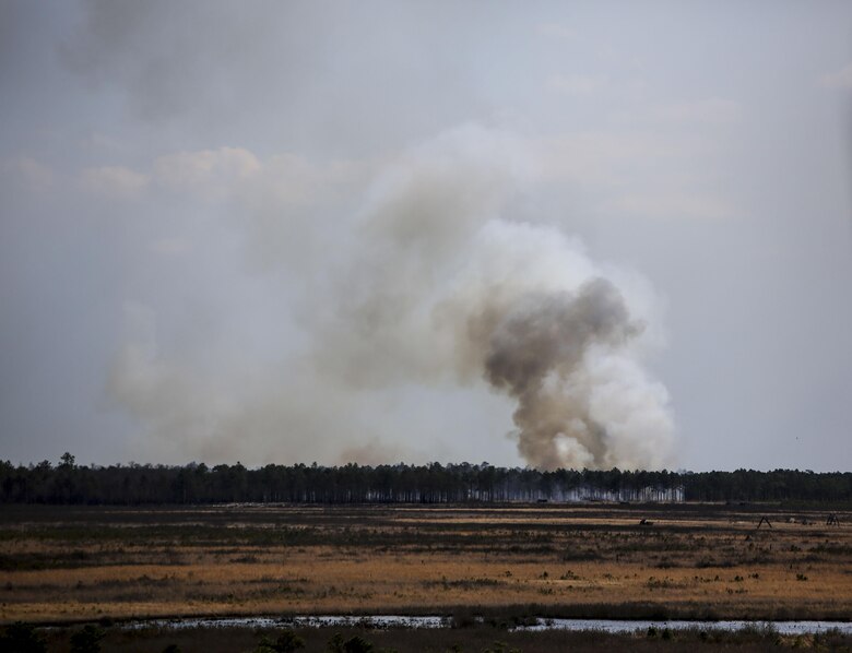 Artillery rounds fired by Marines with 1st Battalion, 10th Marine Regiment make impact at Observation Post 3 during a battalion field exercise held by 2nd Battalion, 8th Marine Regiment at Camp Lejeune, N.C., March 15, 2016. The battalion coordinated with artillery, mortars and rotary-wing aircraft to direct fire support. (U.S. Marine Corps photo by Cpl. Paul S. Martinez/Released)