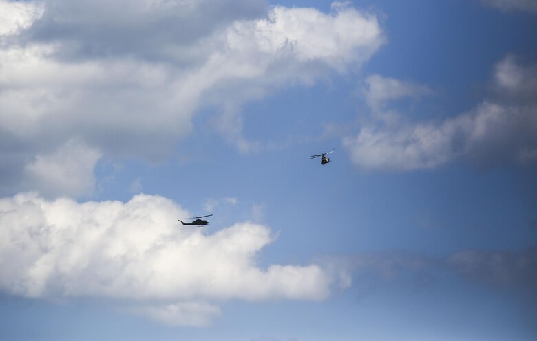 Rotary-wing aircraft operated by Marines with Marine Light Attack Helicopter Squadron 269 circle the airspace above Observation Post 3 during a battalion field exercise held by 2nd Battalion, 8th Marine Regiment at Camp Lejeune, N.C., March 15, 2016. The battalion coordinated with artillery, mortars and rotary-wing aircraft to direct fire support. (U.S. Marine Corps photo by Cpl. Paul S. Martinez/Released)
