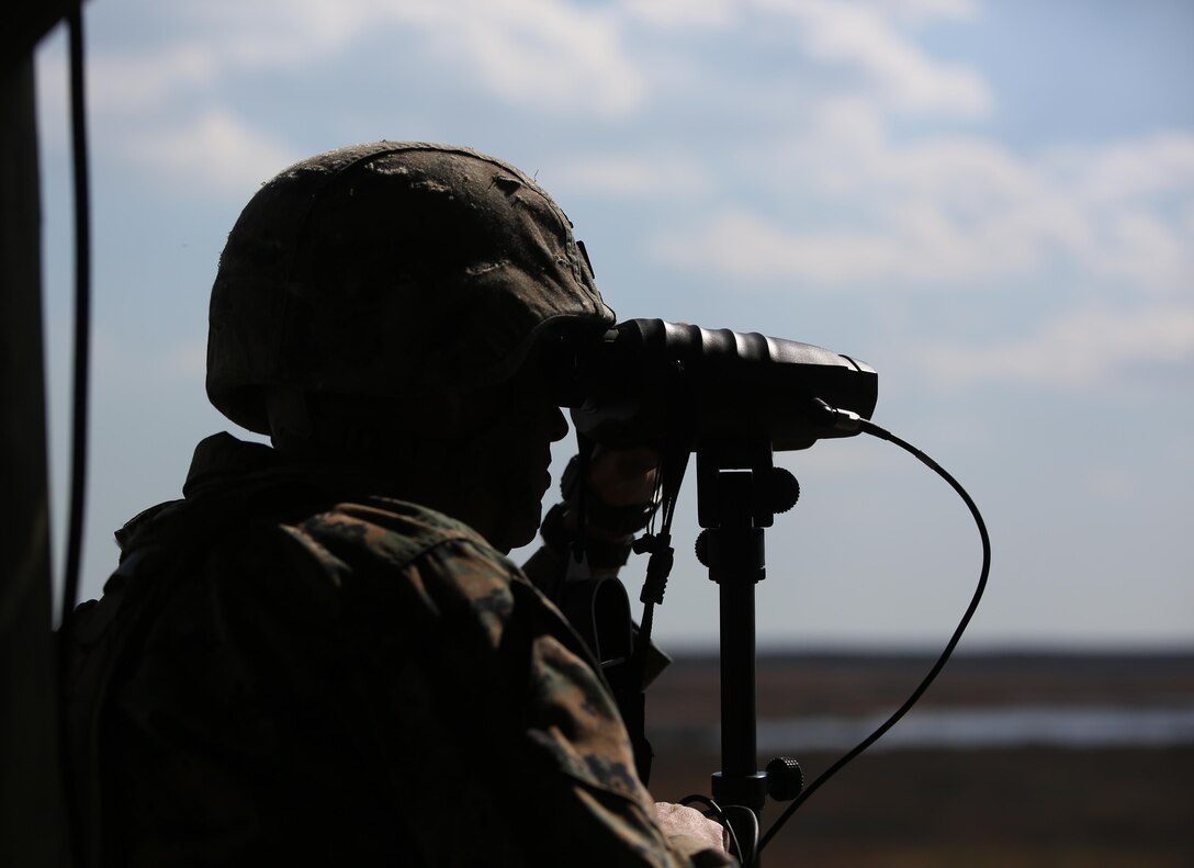Staff Sgt. Nicholas R. Bowling, a joint terminal attack controller with 2nd Battalion, 8th Marine Regiment, observes targets down range during a fire support coordination exercise at Camp Lejeune, N.C., March 15, 2016. The exercise was the first to allow the unit to collaborate with their 1st Battalion, 10th Marine Regiment attachment that will be among them during their upcoming deployment. (U.S. Marine Corps photo by Cpl. Paul S. Martinez/Released)