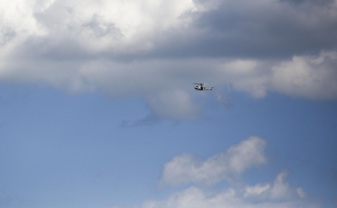 A rotary-wing aircraft operated by Marines with Marine Light Attack Helicopter Squadron 269 circle the airspace above Observation Post 3 during a battalion field exercise held by 2nd Battalion, 8th Marine Regiment at Camp Lejeune, N.C., March 15, 2016. The battalion coordinated with artillery, mortars and rotary-wing aircraft to direct fire support. (U.S. Marine Corps photo by Cpl. Paul S. Martinez/Released)