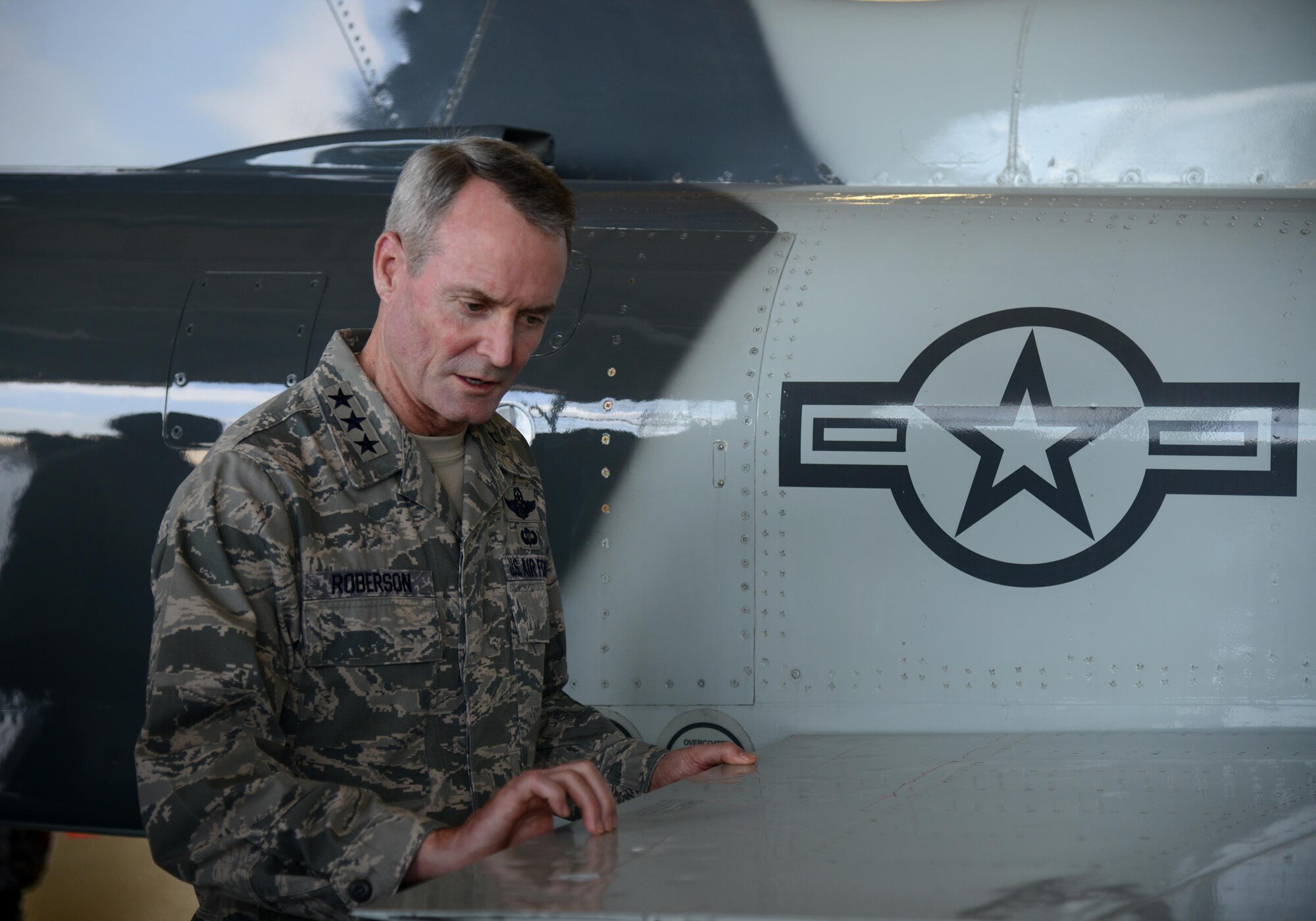 Lt. Gen. Darryl Roberson, commander of Air Education and Training Command, examines the wing of a hail-damaged T-38 Talon at Laughlin Air Force Base, Texas, March 16, 2016, during a base tour. While touring Laughlin, Roberson held an all-call, visited various base agencies and discussed operations with wing leaders. (U.S. Air Force photo by Airman 1st Class Brandon May) 