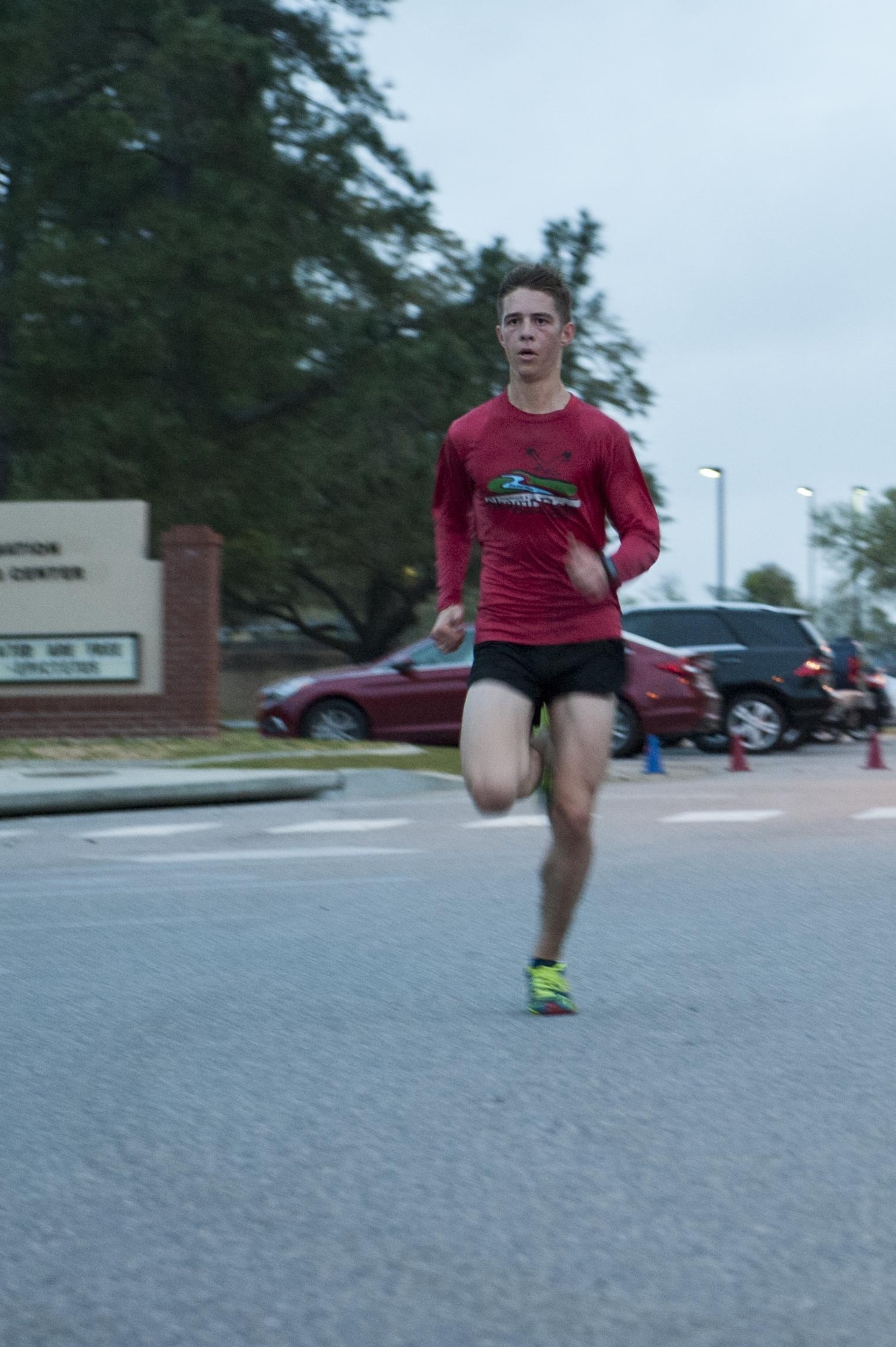 U.S. Air Force Airman 1st Class Tyler Thorne, 74th Aircraft Maintenance Unit load crew member, sprints toward the finish line during the St. Patrick’s Day 5k/10k, March 17, 2016, at Moody Air Force Base, Ga. Thorne finished the race in first place, with a time of 19 minutes, 11 seconds. (U.S. Air Force photo by Airman 1st Class Lauren M. Johnson/Released)