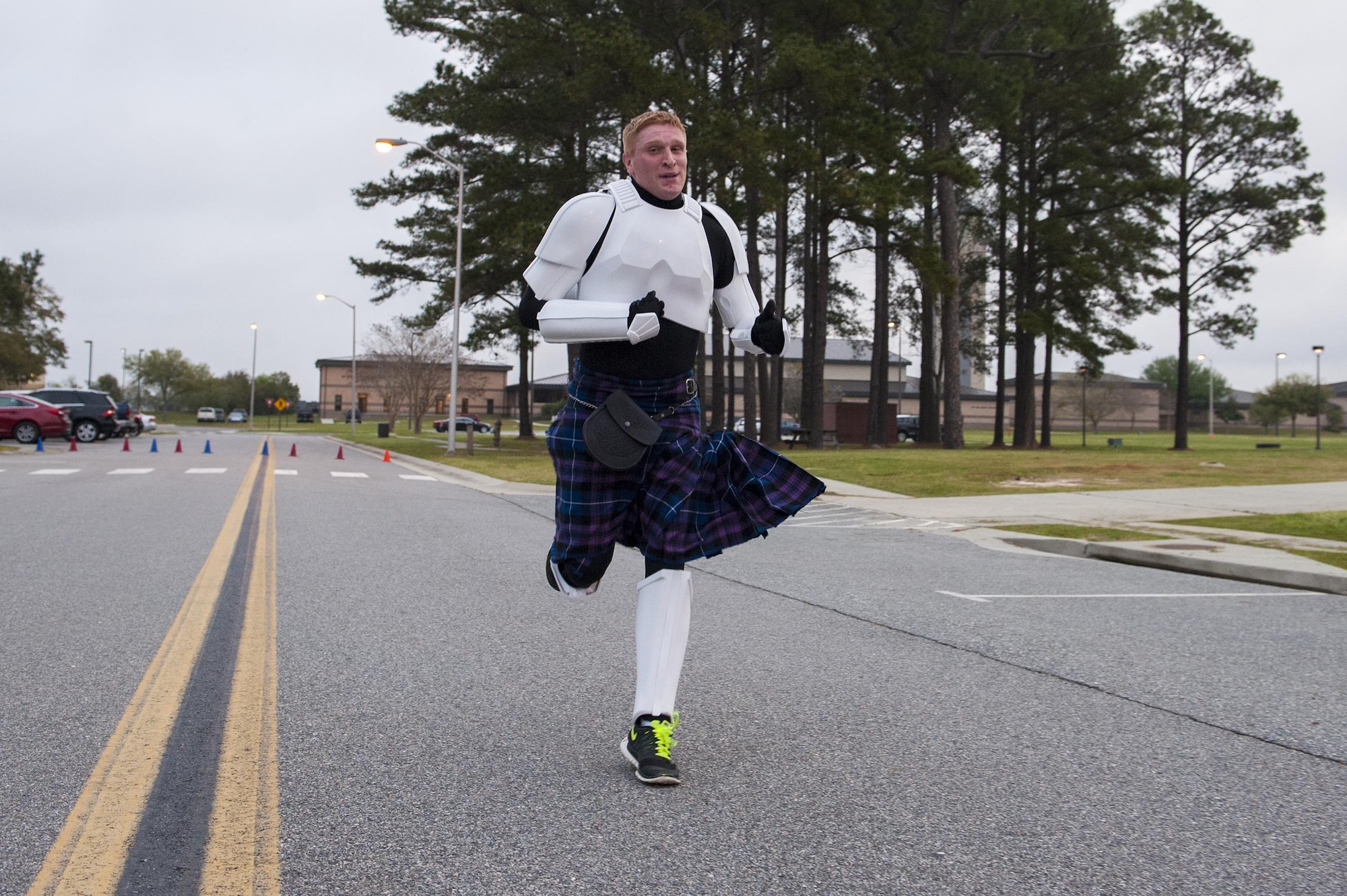 U.S. Air Force Tech. Sgt. Zachary Wolf, 23d Wing Public Affairs NCO in charge of media operations, runs toward the finish line during the St. Patrick’s Day 5k/10k, March 17, 2016, at Moody Air Force Base, Ga. During the run, participants wore green shirts, socks and costumes to show their holiday spirit. (U.S. Air Force photo by Airman 1st Class Lauren M. Johnson/Released)