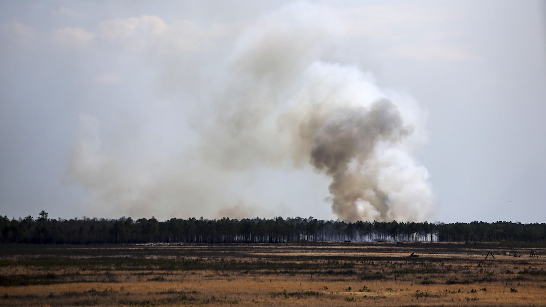 Artillery rounds fired by Marines with 1st Battalion, 10th Marine Regiment make impact at Observation Post 3 during a battalion field exercise held by 2nd Battalion, 8th Marine Regiment at Marine Corps Base Camp Lejeune, North Carolina, March 15, 2016. The battalion coordinated with artillery, mortars and rotary-wing aircraft to direct fire support.