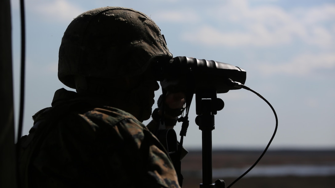 Staff Sgt. Nicholas R. Bowling, a joint terminal attack controller with 2nd Battalion, 8th Marine Regiment, observes targets down range during a fire support coordination exercise at Marine Corps Base Camp Lejeune, North Carolina, March 15, 2016. The exercise was the first to allow the unit to collaborate with their 1st Battalion, 10th Marine Regiment attachment that will be among them during their upcoming deployment. 