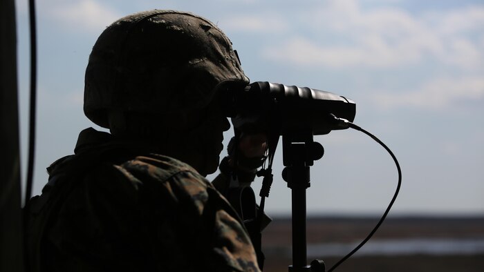 Staff Sgt. Nicholas R. Bowling, a joint terminal attack controller with 2nd Battalion, 8th Marine Regiment, observes targets down range during a fire support coordination exercise at Marine Corps Base Camp Lejeune, North Carolina, March 15, 2016. The exercise was the first to allow the unit to collaborate with their 1st Battalion, 10th Marine Regiment attachment that will be among them during their upcoming deployment. 