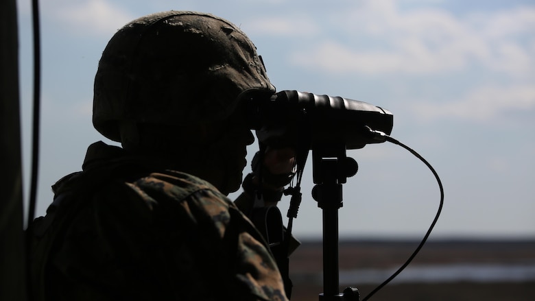 Staff Sgt. Nicholas R. Bowling, a joint terminal attack controller with 2nd Battalion, 8th Marine Regiment, observes targets down range during a fire support coordination exercise at Marine Corps Base Camp Lejeune, North Carolina, March 15, 2016. The exercise was the first to allow the unit to collaborate with their 1st Battalion, 10th Marine Regiment attachment that will be among them during their upcoming deployment. 