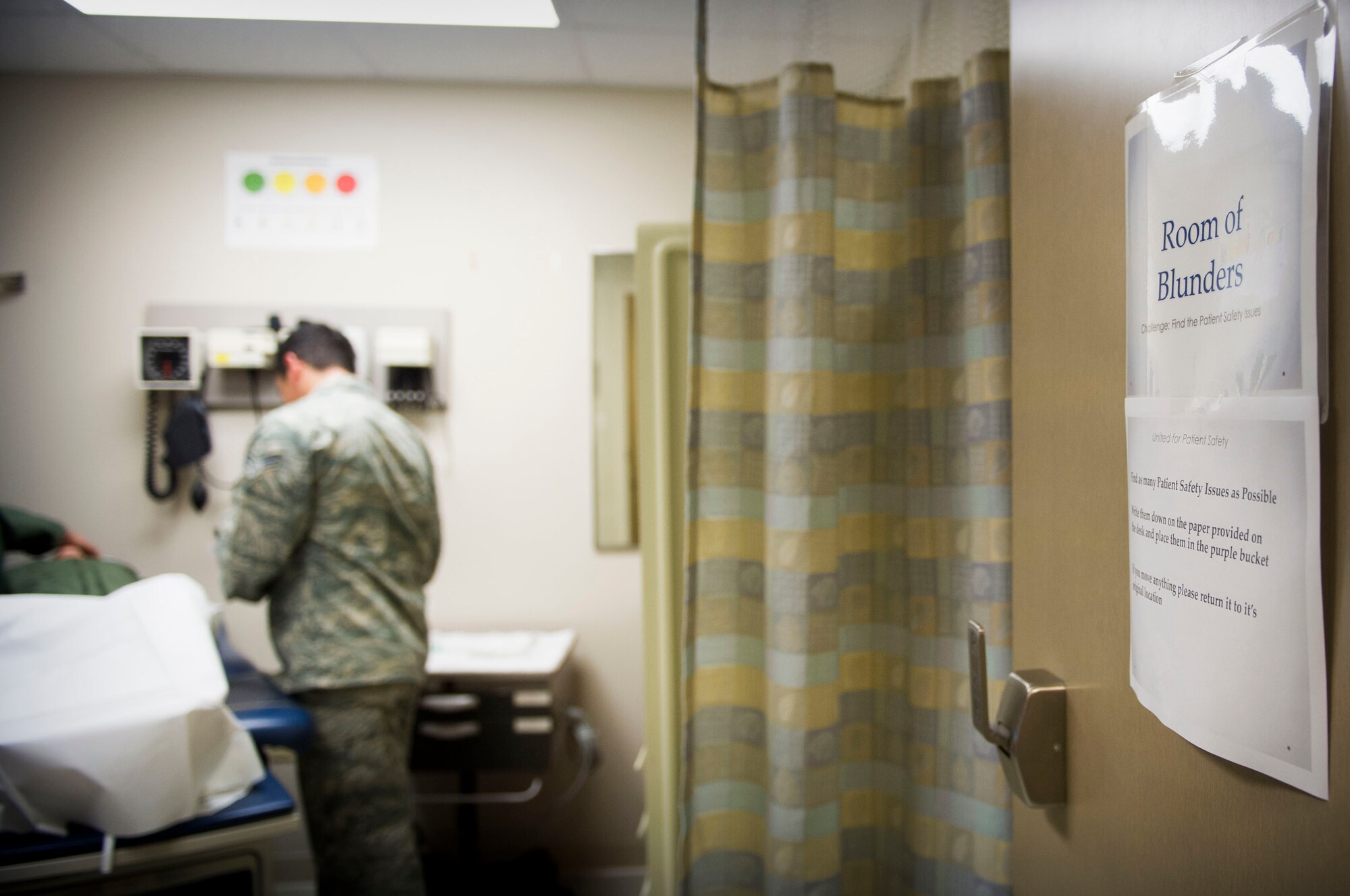 Senior Airman Felix Contreras, medical technician with the 1st Special Operations Medial Group, looks for things that are out of place in a patient care room at Hurlburt Field, Fla., March 16, 2016. Airmen with the 1st SOMDG participated in the ‘Room of Blunders’ training exercise to enhance their awareness safety hazards in a patient care room. (U.S. Air Force photo by Senior Airman Krystal M. Garrett)