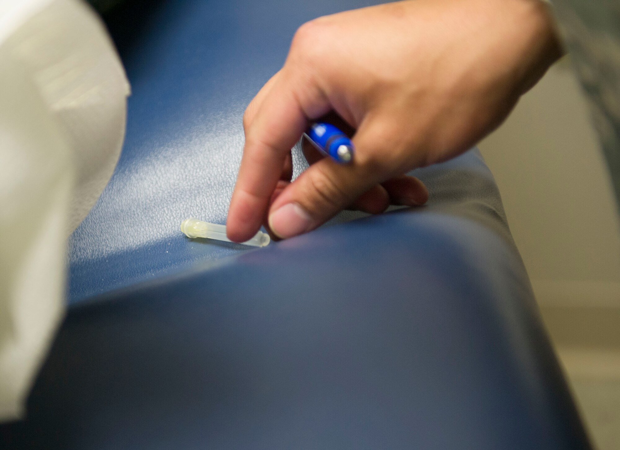 Senior Airman Felix Contreras, medical technician with the 1st Special Operations Medial Group, looks for things that are out of place in a patient care room at Hurlburt Field, Fla., March 16, 2016. Airmen with the 1st SOMDG participated in the ‘Room of Blunders’ training exercise to enhance their awareness safety hazards in a patient care room. (U.S. Air Force photo by Senior Airman Krystal M. Garrett)