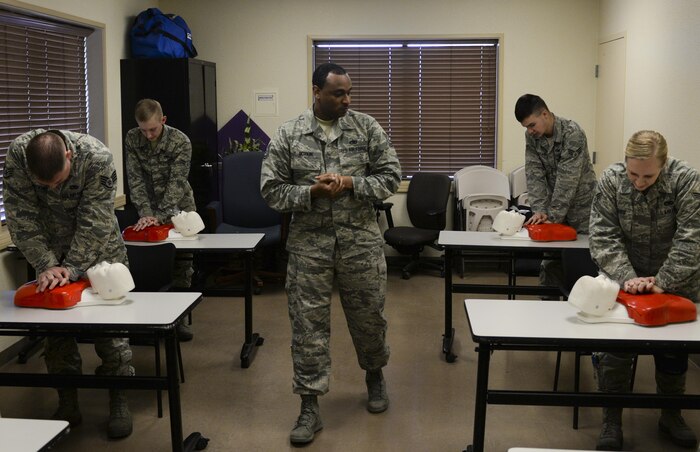 Tech. Sgt. Daniel Boykin, 23rd Maintenance Group Operation Location-Alpha training instructor for the 823rd Maintenance Squadron, instructs Airmen on the proper procedures of CPR at Nellis Air Force Base, Nev., March 14. CPR is a lifesaving first aid procedure useful in a number of emergencies. (U.S. Air Force photo by Airman 1st Class Nathan Byrnes)