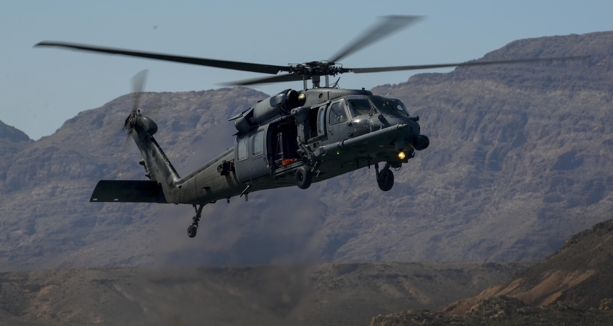 An HH-60G Pave Hawk, assigned to the 58th Rescue Squadron from Nellis Air Force Base, Nevada, preforms water operations training at Lake Mead, March 15, 2016. The primary mission of the HH-60G helicopter is to conduct day or night personnel recovery operations into hostile environments to recover isolated personnel during war. (U.S. Air Force photo by Airman 1st Class Kevin Tanenbaum)