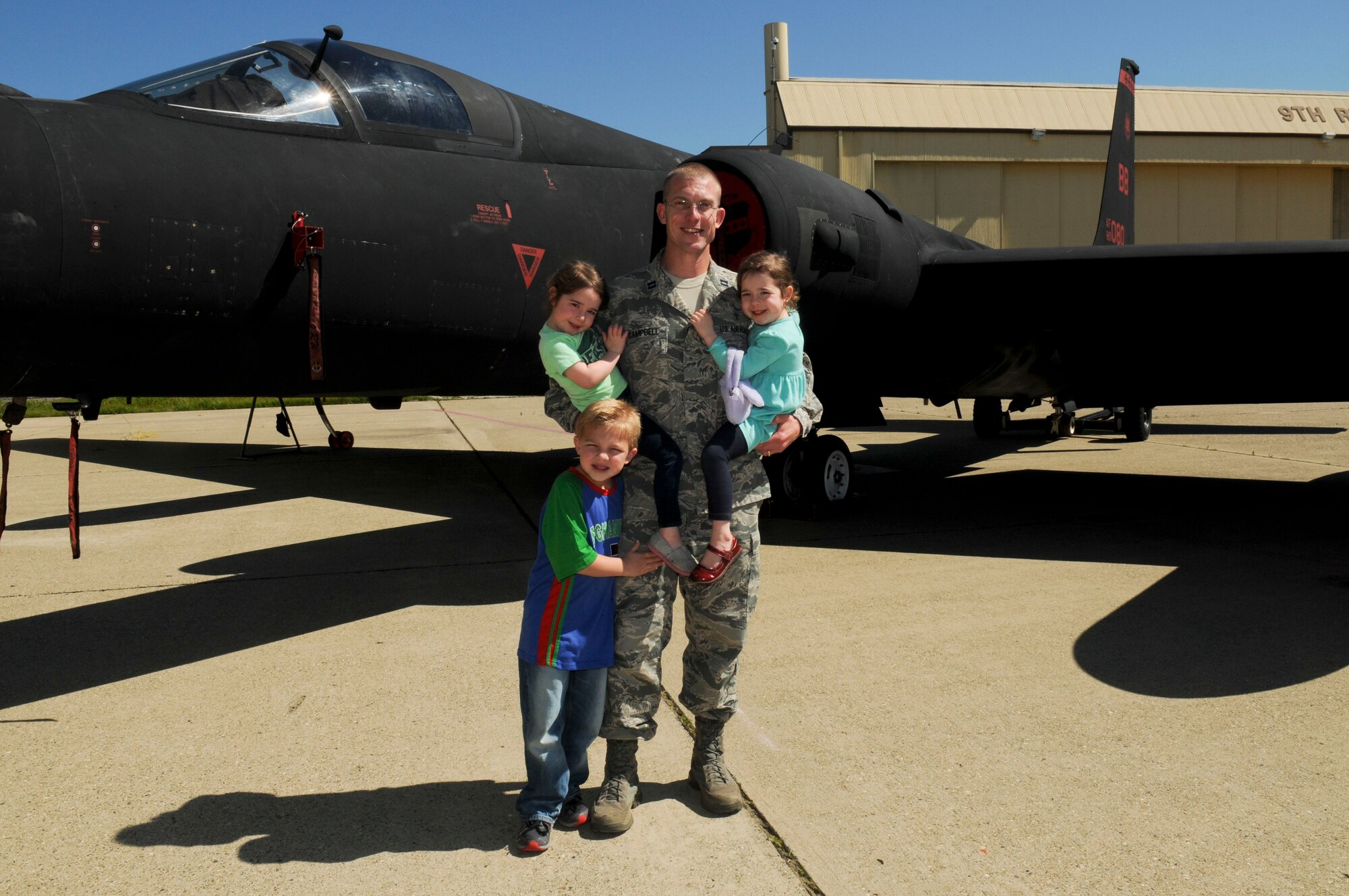 Chaplain (Capt.) R. Brenner Campbell, 9th Reconnaissance Wing chaplain, poses with his children in front of a U-2 Dragon Lady on Beale Air Force Base, California, Mar. 17, 2016. “Airman 2 Airman” fostered an inclusive environment encouraging personnel to be in touch with their spiritual side. (U.S. Air Force photo by Senior Airman Michael Hunsaker)