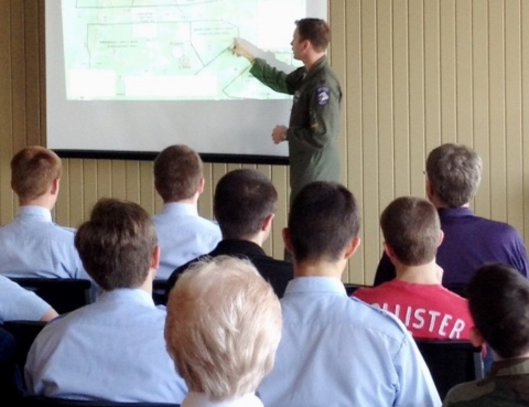 Capt. Jason Greer, 14th Flying Training Wing Flight Safety Officer, briefs Columbus Air Force Base flying operations to over 40 Civil Air Patrol Cadets from the Tuscaloosa and Bessemer, Alabama, CAP Squadrons March 15 at the Tuscaloosa Regional Airport. Greer was joined by Lt. Col. Nathan Smith, 14th FTW Chief of Safety, Maj. Nathan Pruess, Wing Flight Safety Officer, and Capt. Jesse Rosal, 37th Flying Training Squadron Chief of Safety, to present the Mid-Air Collision Avoidance presentation to the group. (Photo courtesy of Civil Air Patrol Cadet 2nd Lt. Cynthia Collette)