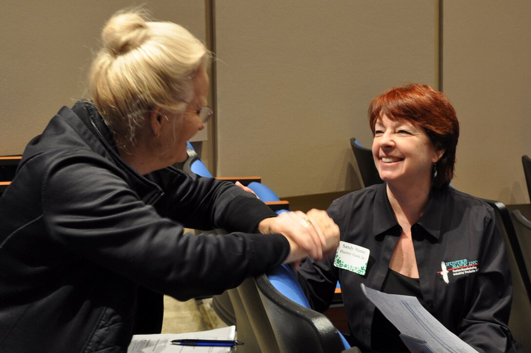 Loretta Molter (Left), CEO of Molter Corporation, networks with Sandy Hunter, CEO and president of Hunter Hawk Inc., at the Small Business Forum March 17, 2016 at Tennessee State University.  About 360 small businesses were represented at the event sponsored by the U.S. Army Corps of Engineers Nashville District, Tennessee Small Business Development Center, and University of Tennessee Center for Industrial Services Procurement Technical Assistance Center.