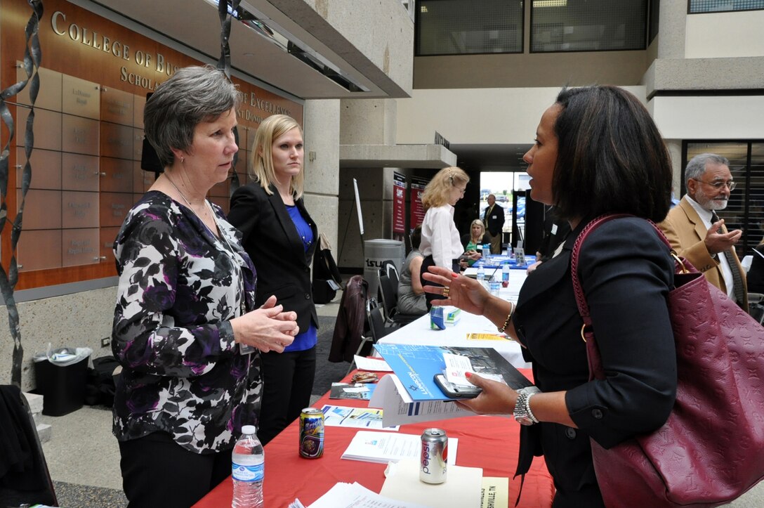 Valerie Carlton (Left), U.S. Army Corps of Engineers Nashville District Contracting chief, provides information to Patricia Bonilla, president and CEO of Lunacon Construction Group, during the Small Business Forum March 17, 2016 at Tennessee State University. The forum focused on women-owned small businesses.  About 360 small businesses were represented at the event sponsored by the U.S. Army Corps of Engineers Nashville District, Tennessee Small Business Development Center, and University of Tennessee Center for Industrial Services Procurement Technical Assistance Center. 