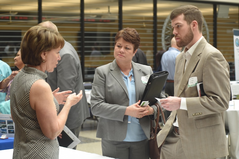 Linda Spadaro (Left), U.S. Army Corps of Engineers Mobile District Small Business Office chief, interacts with Melanie Mitchell, Aqua Marine Enterprises, Inc., and Matt Reed, GoToMarket Solutions, during the 5th Annual Small Business Forum at Tennessee State University in Nashville, Tenn., March 17, 2016.