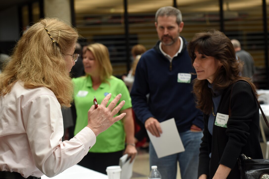 Karen Baker, Huntsville Engineering and Support Center, assists Lori Walters, Win Engineering LLC., during the 5th Annual Small Business Forum at Tennessee State University in Nashville, Tenn., March 17, 2016.