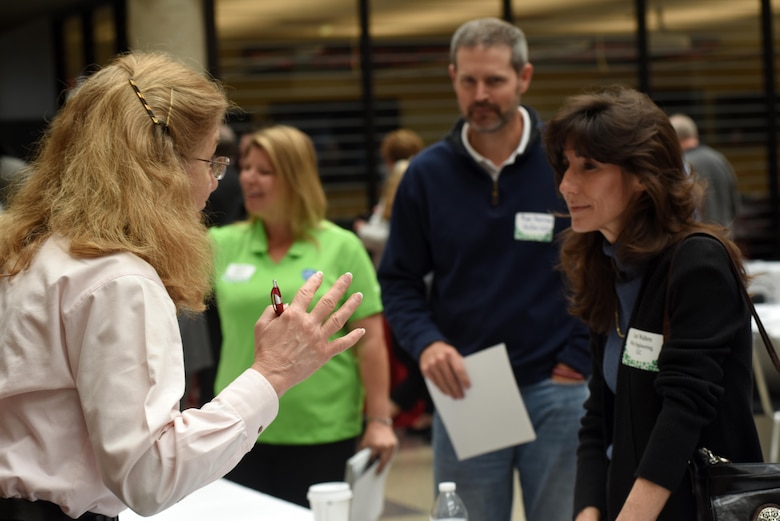 Karen Baker, Huntsville Engineering and Support Center, assists Lori Walters, Win Engineering LLC., during the 5th Annual Small Business Forum at Tennessee State University in Nashville, Tenn., March 17, 2016.