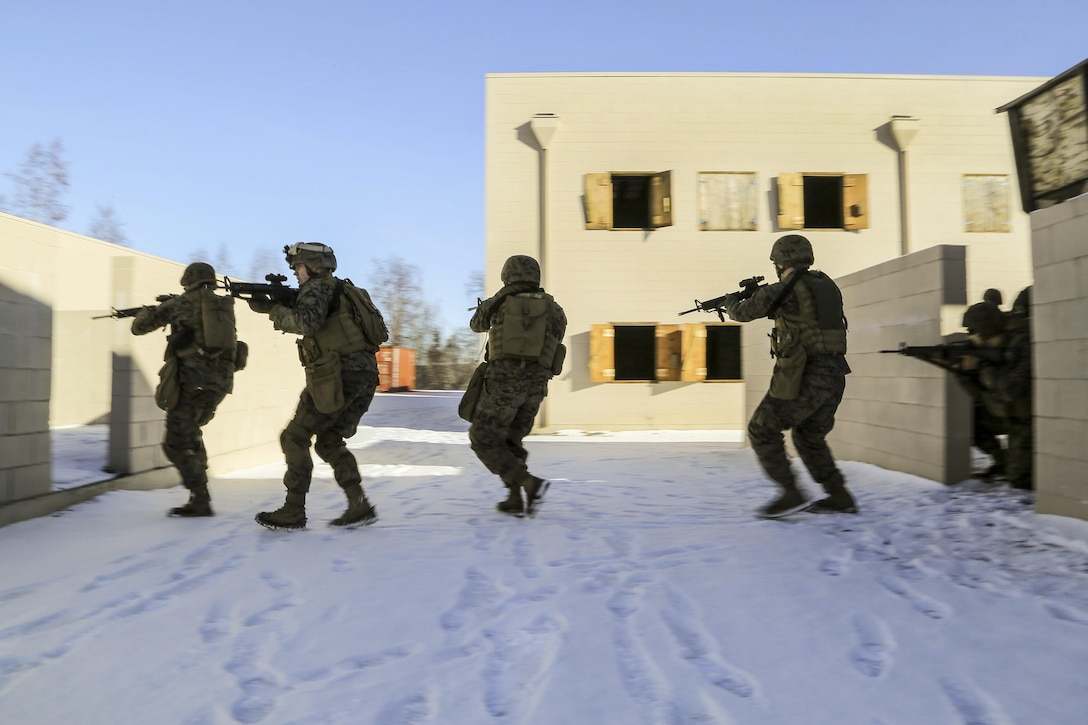 Marines assault and clear a complex during urban terrain training on Joint Base Elmendorf-Richardson, Alaska, March 6, 2016. Air Force photo by Alejandro Pena