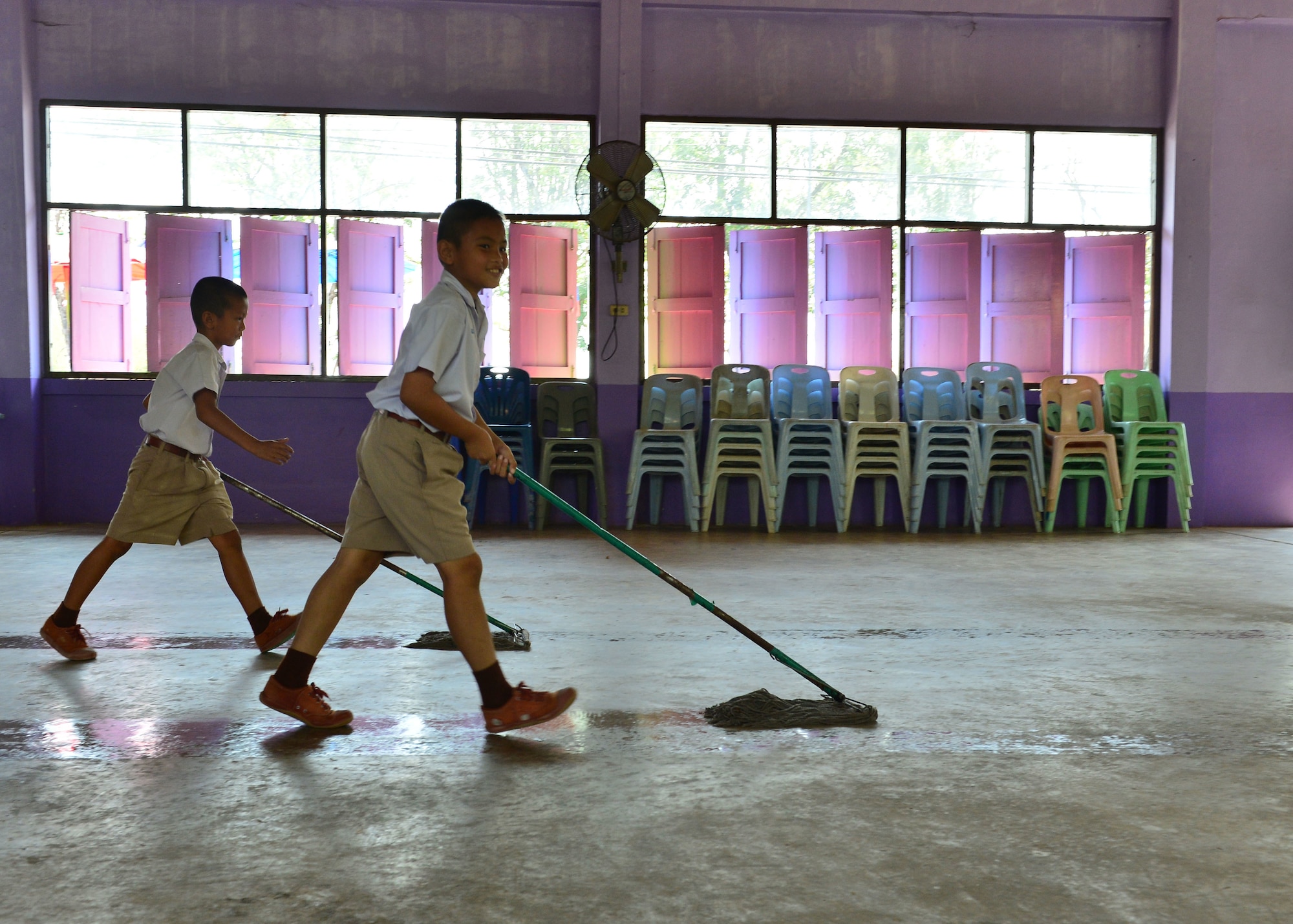 Students prepare the auditorium for the Exercise Cope Tiger 16 combined civic action engagement at Thong Chai Wittaya Primary School, Korat, Thailand, March 14, 2016. The combined civic action engagement provides an outlet for the countries participating in Cope Tiger to give back to the community surrounding Korat Royal Thai Air Force Base. Exercise Cope Tiger is multilateral field training exercise and includes more than 1,200 personnel from the United States, Thailand and Singapore. The purpose of this exercise is to improve readiness and interoperability between three countries and continue the growth of strong relationships within the Asia-Pacific Region. (U.S. Air Force Photo by Tech Sgt. Aaron Oelrich/Released)