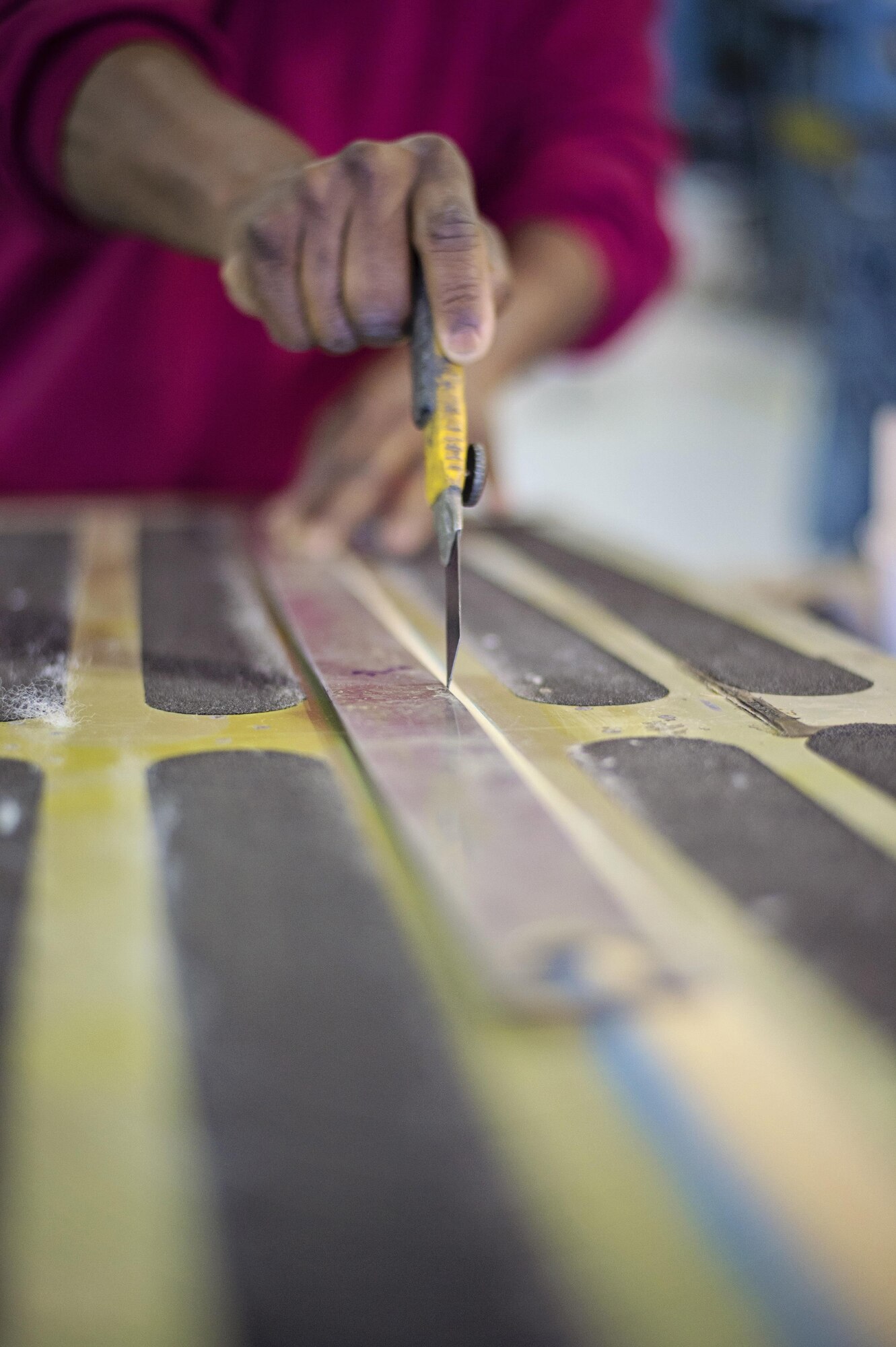 Master Sgt. Antoine Robinson, 512th Maintenance Squadron, repairs chaff strips on a C-5M Super Galaxy toe ramp on Dover Air Force Base, Del., March 18, 2016. Robinson, who’s also a civilian assigned to the 436th Maintenance Squadron, receives an Associate of Applied Science degree in Aviation Maintenance Technology through the Community College of the Air Force this spring. (U.S. Air Force photo/Capt. Bernie Kale)