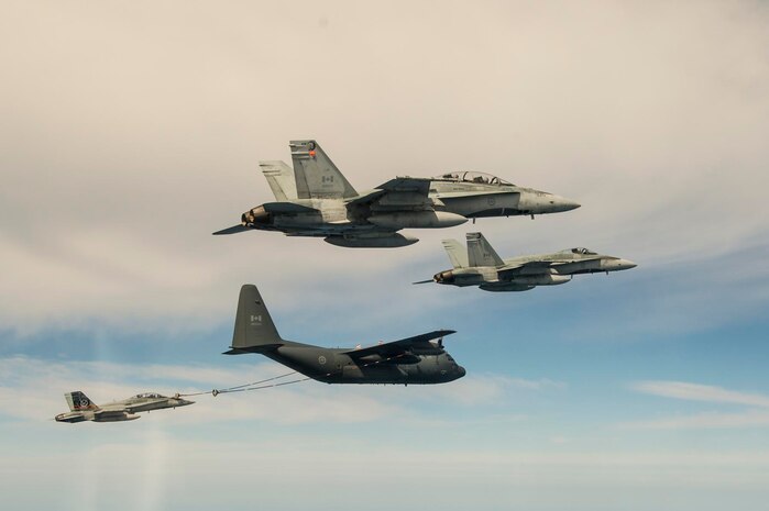 A CF-18 Hornet  refuels from a CC-130 air-to-air refueler during Exercise PUMA STRIKE at Naval Air Station Key West, Florida, United States of America on March 1st 2016.

Exercise PUMA STRIKE 2016, held at Naval Air Station Key West, Florida, is an annual deployment to a warm, southern location to take advantage of better flying conditions. This allows Royal Canadian Air Force Squadrons to conduct more training in less time. During the duration of the deployment over 190 personnel, as many as 22 CF-18 Hornets, along with CC-130 and CC-150 air-to-air refuelers were involved.

Photo by Cpl Andre Maillet, 4 Wing Imaging , Cold Lake, Alberta
CK07-2016-0154-050