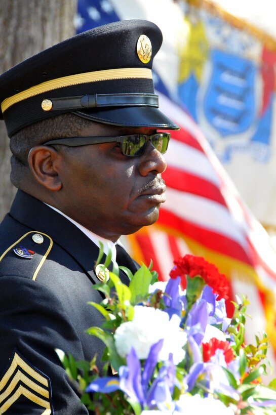 U.S. Army Reserve Soldier Sgt. 1st Class Gregory Pendergrass prepares to lay a wreath of flowers at President Grover Cleveland's gravesite during a ceremony March 18 at the Princeton Cemetery in Princeton, N.J. President Cleveland lived in retirement in Princeton until his death in 1908.