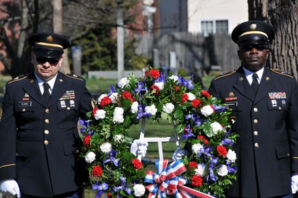 Sgt. 1st Class Gregory Pendergrass (right) and Sgt. 1st Class Jose Flores (left) prepare to lay a wreath of flowers at President Grover Cleveland's gravesite during a ceremony March 18 at the Princeton Cemetery in Princeton, N.J.  President Cleveland lived in retirement in Princeton until his death in 1908.