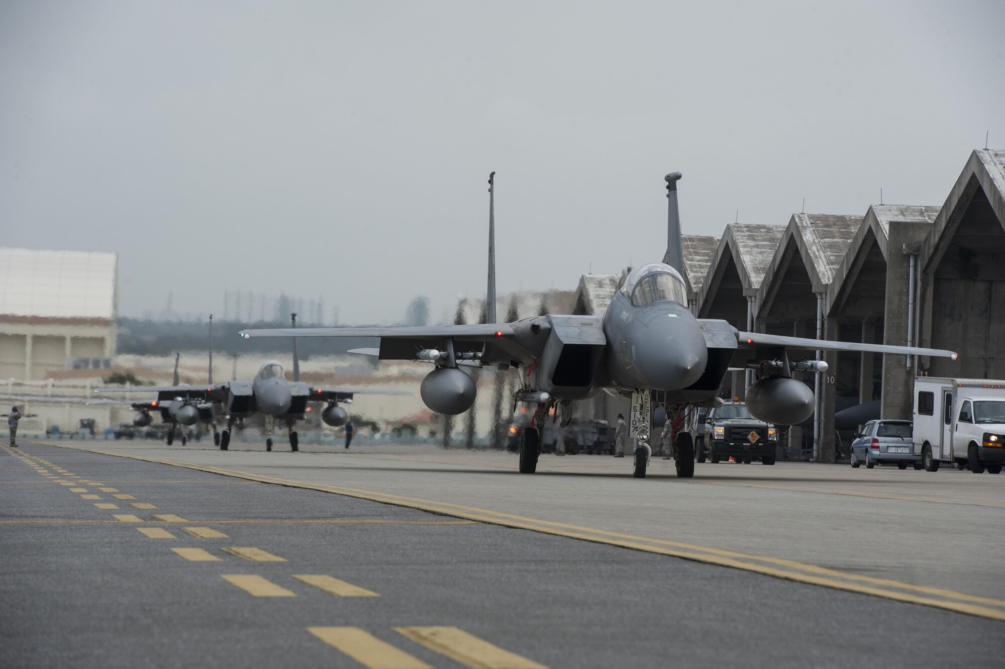 F-15 Eagles from Kadena’s 44th Fighter Squadron taxi down the runway March 18, 2016, at Kadena Air Base, Japan. Members of the 44th FS participated in training to demonstrate Kadena’s air superiority and wartime readiness. (U.S. Air Force photo by Airman 1st Class Lynette M. Rolen) 